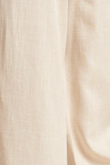 https://cdn.shopify.com/s/files/1/1007/1746/1833/files/24086-Top-Met-V-HalsOmslagmouwen-sand-8.webp?v=1775349001