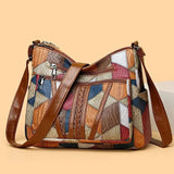 https://cdn.shopify.com/s/files/1/0925/6445/5798/files/Solara_mozaiek_leren_handtas_0.jpg?v=1759950635