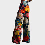 https://cdn.shopify.com/s/files/1/0964/7803/6311/files/bloemenpantalon2-Photoroom.jpg?v=1765267761