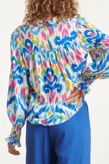 https://cdn.shopify.com/s/files/1/1007/1746/1833/files/imgi_56_24050-Tribal-Print-Blouse-White-Muticolour-6.jpg?v=1775409462