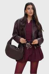 https://cdn.shopify.com/s/files/1/0925/6445/5798/files/woven-medium-bag___Romy_jacket-Photoroom_41d4d248-6b0a-41be-a9fc-273a7b01df29.png?v=1757441365